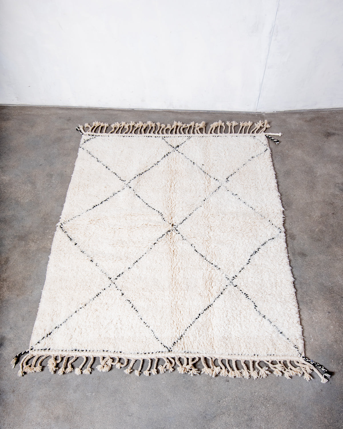 Modern, designer, handcrafted Berber rug from Morocco. Beniourain carpet with minimalist design, natural wool pile and a fluffy texture.